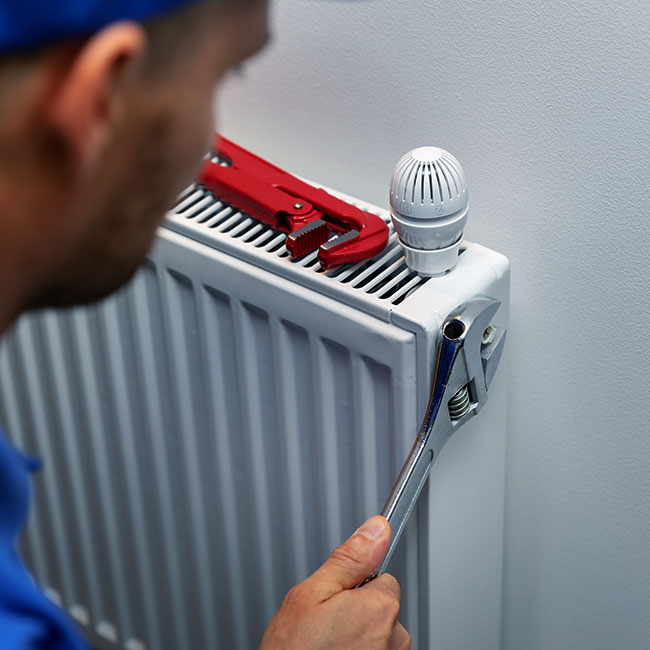 hvac-technician-checking-a-heater-maplewood-mn
